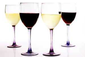 glasses of red and white wine, on white